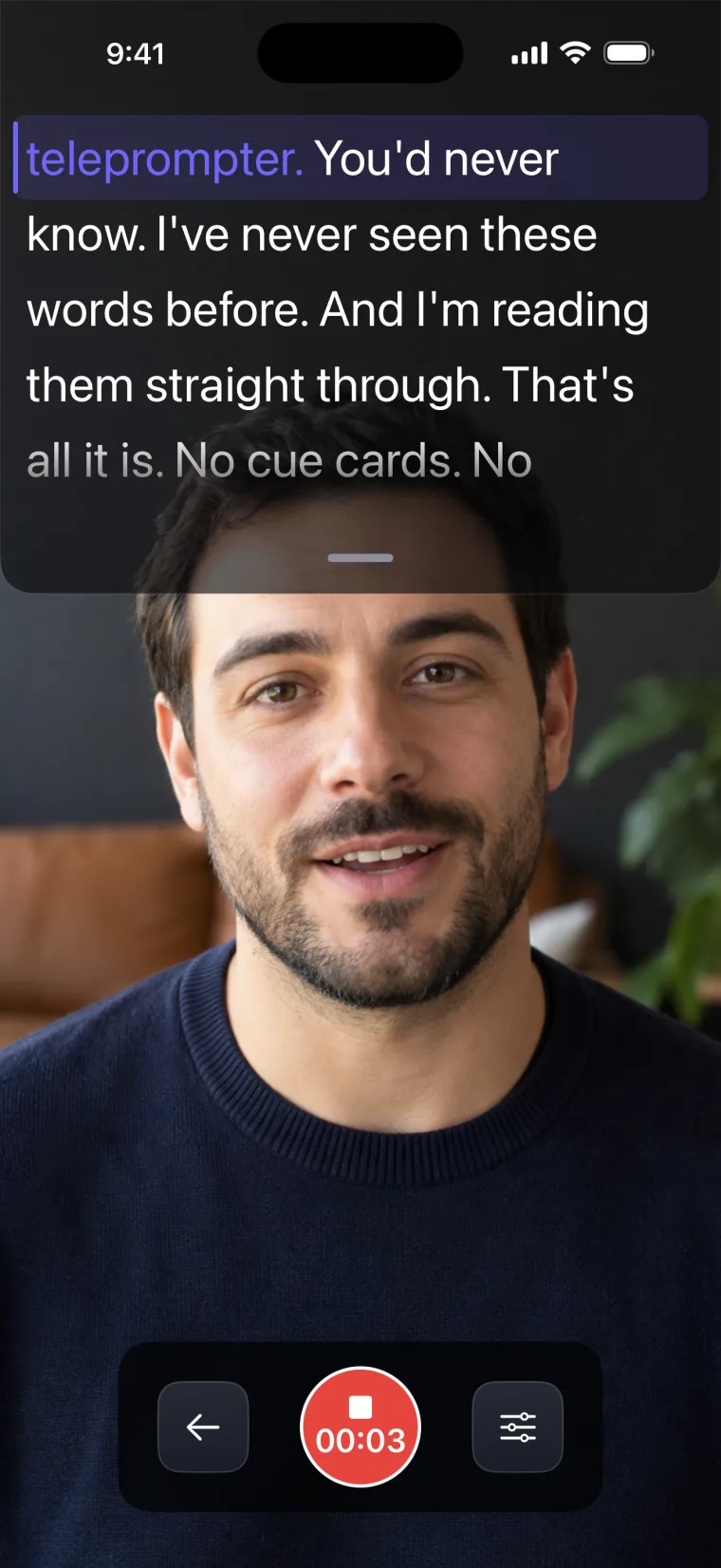 The recording screen. The front camera is at the top edge of the phone, and the script sits right under it, above the man's face.