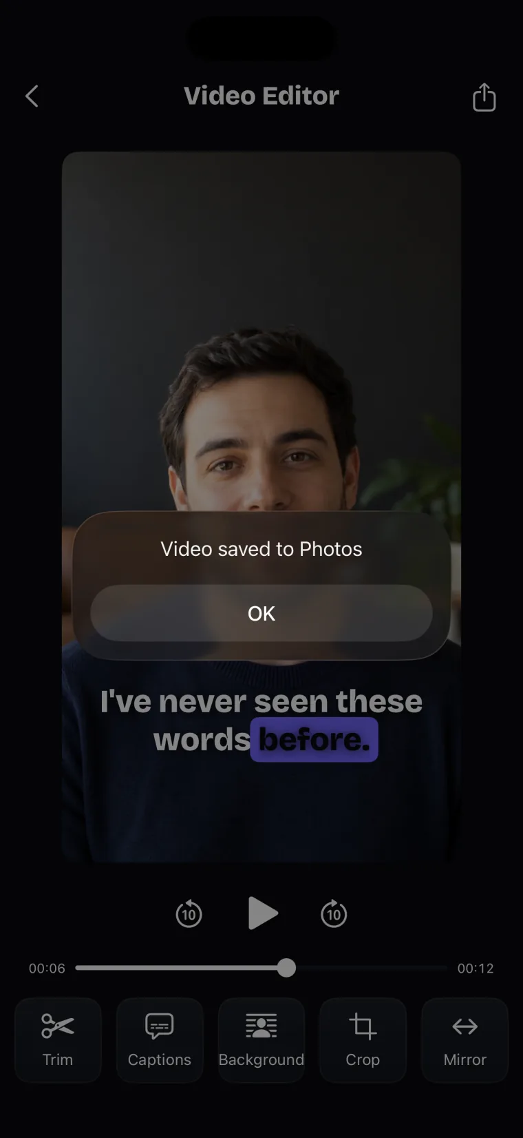 The Video Editor with a message saying Video saved to Photos and an OK button over the dimmed take.